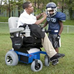 Coach Sonny uses his Hoveround to stay in the game